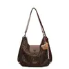 Nova bolsa tote popular Yuezhi 2026 outono inicial, bolsa de ombro retrô moderna com estampa de leopardo, bolsa de bolinho