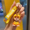 Llavero de cachorro de dibujos animados equipo Wang Wang colgante para llave de coche colgante para mochila escolar de pareja muñeco de máquina expendedora regalo pequeño venta al por mayor
