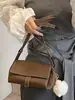 Bolsa Pequena Texturizada Retrô Transfronteiriça para Mulheres 2026 Novo Estilo Simples e Elegante Bolsa Almofada Bolsa de Ombro Transversal Retrô de Nicho