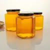 Botella hexagonal de miel, botella de vidrio para salsa, botella de salsa picante, botella de mermelada, lata sellada de múltiples especificaciones