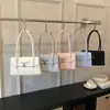 Bolsa Pequena Preta e Rosa de Cor Contrastante com Laço para Mulheres 2026 Nova Coleção Primavera Bolsa de Ombro Único de Axila Moda Doce Pequena Bolsa de Mão