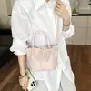 Bolso de Mano para Exteriores de Gama Alta Súper Popular Exquisito para Mujer 2026 Nuevo Verano Nicho para el Trabajo Bolso de Hombro Cruzado