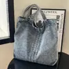 Bolso de Mezclilla Transfronterizo para Mujer Verano 2026 Nueva Moda Bolso Tote Versátil Gran Capacidad Bolso de Hombro para Viajes de Negocios Moderno