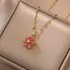 Collar para Mujer Moda Nicho Nuevo Diseño Colgante Celebridad de Internet Flor de Zircón Bauhinia Giratoria Temperamento Collar de Acero Titanio