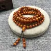 Venta al por mayor de fábrica pulsera de seda dorada sauce marino pulsera de cuentas para hombre coral negro sauce de sangre 108 Wenwan segunda generación sauce marino pareja