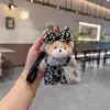 Bolsa de hombro de dibujos animados creativa, decoración de bolsa de peluche, linda falda con tirantes de estampado de leopardo, colgante de llavero de oso de peluche