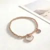 Nueva oferta especial pulsera de acero inoxidable con cuentas y colgante de cruz transfronteriza, alta calidad para mujer, cuenta redonda, acero de titanio, cordón elástico
