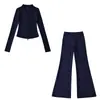 Fabricante mayorista de ropa para mujer transfronteriza 2026 cárdigan térmico de ajuste slim con cuello alto y cremallera y conjunto de pantalones de microcampana hasta el suelo