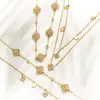 Collar con colgante de flor de cuatro pétalos más vendido con piedras de circonita, acero inoxidable, minimalista, nicho, pulsera y collar de moda para mujer