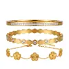 Pulsera de acero de titanio para mujer, pulsera de trébol de cuatro hojas chapada en oro, no se decolora, ecológica, joyería al por mayor estilo europeo y americano