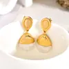 Brincos de Aço Inoxidável em Forma de Nó com um Toque Levemente Luxuoso e de Alta Qualidade, Tachos Curvos, Pedra Olho de Gato, Brincos de Madrepérola, Brincos de Bola de Durian