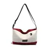 Bolsas Pequenas para Homens e Mulheres 2025 Primavera Nova Moda Estilo Coreano Bolsa de Ombro Único Transversal Bolsa Quadrada Pequena de Lona com Bloqueio de Cor Estudante Tendência
