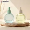 Botella gotero redonda plana de 30/60 ml Botella de vidrio para loción cosmética Botella para productos de cuidado de la piel Botella rellenable Venta al por mayor