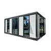 Casa contenedor de bloques de color con puerta de entrada de cristal grande, adecuada para alojamientos en zonas escénicas, campamentos al aire libre y vida móvil