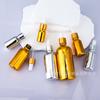 Frasco de vidro para óleo essencial dourado galvanizado 10-100ml conta-gotas com cabeça de borracha frasco para subdivisão frasco spray prateado atacado