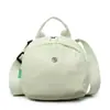 Bolsa de Tela de Nylon para Mujer Verano 2025 Nuevo Diseño de Nicho Bolso Cruzado Casual y Elegante Versátil Bolsa tipo Concha Bolsa para Teléfono Móvil