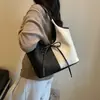 Bolso tote de gran capacidad para mujer, nuevo modelo de verano 2026, bolso simple casual para el hombro, bolso versátil de moda para mujer