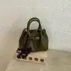 Bolso de mano tejido de estilo coreano de alta moda para mujer, otoño temprano 2026, bolso tote pequeño, bolso de hombro tipo cubo elegante y simple