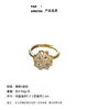 Anillo giratorio de trébol de cuatro hojas hueco exquisito de moda europea y americana, anillo de estilo nicho de alta gama para mujer, en stock