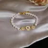 Pulsera de perlas con lazo de doble capa estilo vintage francés, diseño único y versátil, joyería de lujo ligero y de alta gama