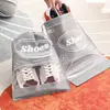 Artefacto de almacenamiento zapatos almacenamiento bolsa de zapatos no tejida a prueba de polvo a prueba de humedad moho arnés de viaje bolsa con cordón venta al por mayor en stock