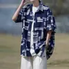 Camisa de manga curta color block para homens, estilo verão, roupas masculinas de seda gelada, marca da moda, jaqueta de corte solto, camisa floral estilosa, atacado direto da fonte