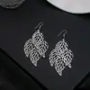 Pendientes huecos con hojas simples transfronterizas de Europa y Estados Unidos, pendientes de borlas largas con estrellas de cinco puntas de múltiples capas creativos exagerados al por mayor