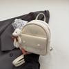 Pedido Extranjero Mochila de Diseño Nicho de Alta Gama para Mujer 2025 Nueva Moda Estudiante Universitario Plata de Mano Mochila Pequeña