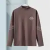 Camiseta térmica de capa base para hombre de otoño e invierno, camiseta de manga larga con cuello semi-alto, top de marca de moda, ropa de alta calidad para hombre
