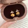 Pendientes de Plata 925 con Cierre de Mariposa Estilo Yadan Retro Lujo Ligero Temperamento Ojo de Tigre Maillard Estrella de Cuatro Puntas Dulces Frescos Versátiles