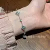 Venta al por mayor del fabricante Xiaohongshu Pulsera de Jade de Trébol de Cuatro Hojas Azul Natural Raro con Incrustaciones de Plata S925, Alto Valor Estético