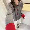 Nueva ropa de punto de lana pura para mujer de otoño e invierno, nuevo cárdigan abotonado de color bloqueado estilo chino, abrigo grueso holgado