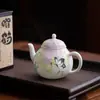 Exquisita tetera de cerámica con flor de glicina pintada a mano, un lujoso juego de té artesanal, con color bajo vidriado y un hermoso diseño, perfecto para té de una sola porción