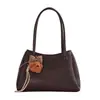 Bolsa de mão com textura de alta qualidade para mulheres 2026 verão nova moda de nicho bolsa de ombro popular versátil bolsa de ombro único