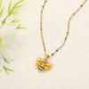 Europa y Estados Unidos suministro transfronterizo moda cobre chapado en oro real micro incrustado circón alto color animal forma de abeja colgante collar mujeres