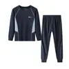 Ropa interior térmica deportiva de lyocell y acetato para niños de otoño e invierno 2026 nuevo modelo conjunto de hogar de tops y pantalones de otoño para niños y niñas