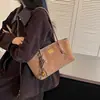 Bolso de mano vintage de ante para mujer, nuevo modelo otoño e invierno 2025, textura de nicho de alta gama, bolso de axila para el día a día