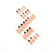 Item de venda quente do comércio exterior 24 peças nail art delicado estilo pequeno Chanel preto e branco bolinhas flores francesas amêndoa curta unhas postiças atacado