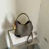 Bolso de cubo de nicho nuevo transfronterizo 2026, versátil y elegante, bolso de hombro y bandolera, bolso de mano con cadena, bolso vintage para madre e hija