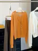 Top de punto hueco tipo malla estilo coreano de dos piezas falsas de manga larga para mujer 2026, cuello en V holgado, rejuvenecedor, top delgado A13287