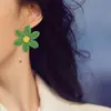 Pendientes de flor de rafia transfronterizos de Europa y Estados Unidos, pendientes de alta gama tejidos a mano, joyería de estilo vacacional para sesión de fotos de viaje para mujer, venta al por mayor