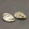 Botones metálicos ovalados cóncavos irregulares, versátiles para trajes, cárdigans de punto, abrigos y prendas de abrigo.