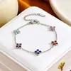 Pulseira de aço titânio com trevo de quatro folhas e strass para mulheres, best-seller transfronteiriço europeu e americano, joia requintada de luxo leve, pulseira versátil estilo europeu e americano