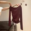 Camiseta blanca de manga larga con hombros descubiertos y cintura fruncida para mujer, nuevo estilo americano otoño 2026 top picante de hombros descubiertos para chica