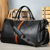 Estilo europeo y americano, bolsa de viaje para hombre de piel de vaca de primera capa, gran capacidad, con compartimento separado para zapatos, bolsa de gimnasio de cuero genuino, disponible en stock y personalizable
