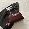 Bolsa Transfronteiriça 2025 Nova Bolsa Bolsa de Ombro Feminina Moderna e Versátil Retrô Trabalho Deslocamento Portátil Bolsa Bowling