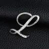 Temperamento de comercio exterior europeo y americano 26 broches de letras inglesas femenina diamante personalidad Joker moda corsage pin masculino accesorios