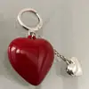 Chaveiro Laço Coração Vermelho Moda Versátil Chaveiro de Bolsa Pequeno Pingente de Chave Coração de Pêssego