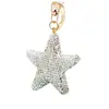 Llavero de coche con forma de estrella de cinco puntas relleno de arcilla y adornado con diamantes, charm para bolso, llavero, accesorio de alta gama, colgante de estrella, regalo
