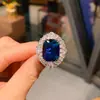 Moda europea y americana simulación tansan Anillo de diamante azul tesoro piedra principal 10*12